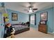 Bedroom featuring light blue walls, a ceiling fan, and -themed decor at 5914 Goldenbark Pl, Lithia, FL 33547