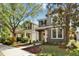 Charming two-story home with well-kept landscaping, featuring a bright yellow front door and inviting entryway at 5914 Goldenbark Pl, Lithia, FL 33547