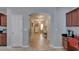 Hallway featuring tile flooring and an archway leading to other rooms at 5914 Goldenbark Pl, Lithia, FL 33547