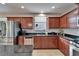 Updated kitchen with stainless steel appliances and stone countertops at 5914 Goldenbark Pl, Lithia, FL 33547
