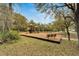 A view of the community playground with slides, swings, and safe play surfaces at 5914 Goldenbark Pl, Lithia, FL 33547