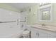 Bathroom featuring a shower-tub combo with tiled walls, a vanity with a sink, and a toilet at 5920 80Th N St # 103, St Petersburg, FL 33709