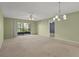Bright living room with overhead fans and sliding glass door access to outdoor patio at 5920 80Th N St # 103, St Petersburg, FL 33709