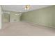 Open living room with neutral paint and carpet at 5920 80Th N St # 103, St Petersburg, FL 33709