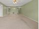 Open living room with neutral carpet and paint scheme at 5920 80Th N St # 103, St Petersburg, FL 33709