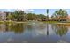 View of a serene pond with a fountain, enhancing the beauty of the community at 5920 80Th N St # 103, St Petersburg, FL 33709