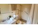 Bathroom featuring accessible walk-in shower, safety grab bars, vanity with sink and fixtures at 5967 Terrace Park N Dr # 101, St Petersburg, FL 33709