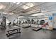 Community gym equipped with treadmills, stationary bikes, and weight machines for residents at 5967 Terrace Park N Dr # 101, St Petersburg, FL 33709