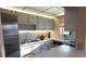 Cozy kitchen with modern white cabinets and stainless steel appliances at 5967 Terrace Park N Dr # 101, St Petersburg, FL 33709