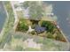 Aerial perspective of the property highlighting the lot boundaries, home, and private waterfront access at 6501 Barcellona Rd, Land O Lakes, FL 34637