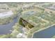 Aerial view of the property showing the lot lines and surrounding woods and waterways at 6501 Barcellona Rd, Land O Lakes, FL 34637