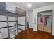 This bedroom has hardwood floors, closet, and a lofted bed at 6501 Barcellona Rd, Land O Lakes, FL 34637