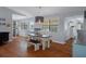 Open-concept dining room with modern lighting and access to the kitchen at 6501 Barcellona Rd, Land O Lakes, FL 34637