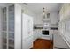 Well-lit kitchen with white cabinetry, modern appliances, and ample counter space at 6501 Barcellona Rd, Land O Lakes, FL 34637