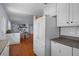 Bright kitchen area with white appliances, ample counter space and eat-in dining area at 6501 Barcellona Rd, Land O Lakes, FL 34637