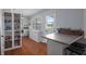 Bright kitchen featuring white cabinets and stainless appliances, offering a modern and functional space at 6501 Barcellona Rd, Land O Lakes, FL 34637