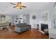 Inviting living room with hardwood floors, fireplace, and neutral decor at 6501 Barcellona Rd, Land O Lakes, FL 34637