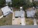 Aerial view of a single-story home surrounded by trees and other residential properties at 6710 Hibiscus S Ave, South Pasadena, FL 33707