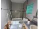 Bathroom with tiled shower and vanity, ready for renovation at 6710 Hibiscus S Ave, South Pasadena, FL 33707
