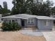 Charming single-story home with a well-maintained front yard and neutral gray paint at 6710 Hibiscus S Ave, South Pasadena, FL 33707
