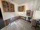 Kitchen with tile flooring and wood cabinets, ready for full renovation at 6710 Hibiscus S Ave, South Pasadena, FL 33707