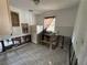 Kitchen with tile flooring and wood cabinets, ready for full renovation at 6710 Hibiscus S Ave, South Pasadena, FL 33707