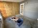 Back porch featuring a door to the exterior, plywood accent wall and a door to the home's interior at 6710 Hibiscus S Ave, South Pasadena, FL 33707