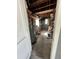 Storage room featuring water heater, block walls, and ready for renovation or repurposing at 6710 Hibiscus S Ave, South Pasadena, FL 33707