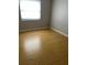 This bedroom features laminated wood flooring at 7210 N Manhattan Ave # 1311, Tampa, FL 33614