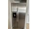 Side-by-side stainless steel refrigerator with water and ice dispenser at 7210 N Manhattan Ave # 1311, Tampa, FL 33614