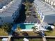 Aerial view of the townhouse community with a pool and boat access at 745 Pinellas Bayway S # 206, St Petersburg, FL 33715