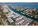 Aerial view of the condo complex and boats docked along the water at 745 Pinellas Bayway S # 206, St Petersburg, FL 33715