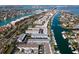 Wide aerial view of the waterfront community with boat docks and nearby bridge at 745 Pinellas Bayway S # 206, St Petersburg, FL 33715