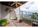 Charming balcony featuring a hanging chair, a ceiling fan, and a view of the community at 745 Pinellas Bayway S # 206, St Petersburg, FL 33715