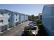 Exterior view of the condo complex, showing architectural details and parking area at 745 Pinellas Bayway S # 206, St Petersburg, FL 33715