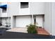 Well-maintained townhouse with a one-car garage, tidy landscaping, and a welcoming entrance at 745 Pinellas Bayway S # 206, St Petersburg, FL 33715