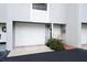 Well-maintained townhouse with a one-car garage, tidy landscaping, and a welcoming entrance at 745 Pinellas Bayway S # 206, St Petersburg, FL 33715