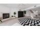 Bright living room with fireplace, staircase, ceiling fan and elegant decor at 745 Pinellas Bayway S # 206, St Petersburg, FL 33715