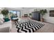 Bright living room with fireplace and sliding glass doors to the balcony at 745 Pinellas Bayway S # 206, St Petersburg, FL 33715