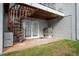Outdoor patio with spiral staircase and attached AC unit at 745 Pinellas Bayway S # 206, St Petersburg, FL 33715