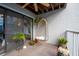 Outdoor patio with hanging chair and lush plants at 745 Pinellas Bayway S # 206, St Petersburg, FL 33715