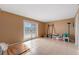 Spacious room with tile flooring, white trim, and glass doors leading to the exterior at 745 Pinellas Bayway S # 206, St Petersburg, FL 33715