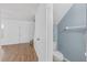Welcoming entryway with laminate flooring and a view into an adjacent powder room at 7627 Deleon Ct, Tampa, FL 33615