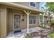 Charming home entrance with decorative security door and well-maintained landscaping at 7627 Deleon Ct, Tampa, FL 33615