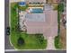 An aerial view showcasing a home with a pool, patio, and well-maintained landscaping at 7851 120Th St, Seminole, FL 33772