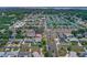 Aerial view of a neighborhood showcasing a home with a pool and fenced-in yard at 7851 120Th St, Seminole, FL 33772