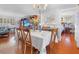 Dining area showcases table and chairs with view to the living area and main bedroom at 7851 120Th St, Seminole, FL 33772