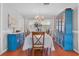 Dining area features a formal dining table and chairs with blue China cabinet at 7851 120Th St, Seminole, FL 33772