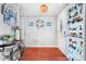 Bright entryway featuring hardwood floors, decorative lighting, and a display cabinet at 7851 120Th St, Seminole, FL 33772