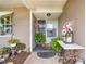 Inviting front porch with decorative plants and stylish decor at 7851 120Th St, Seminole, FL 33772